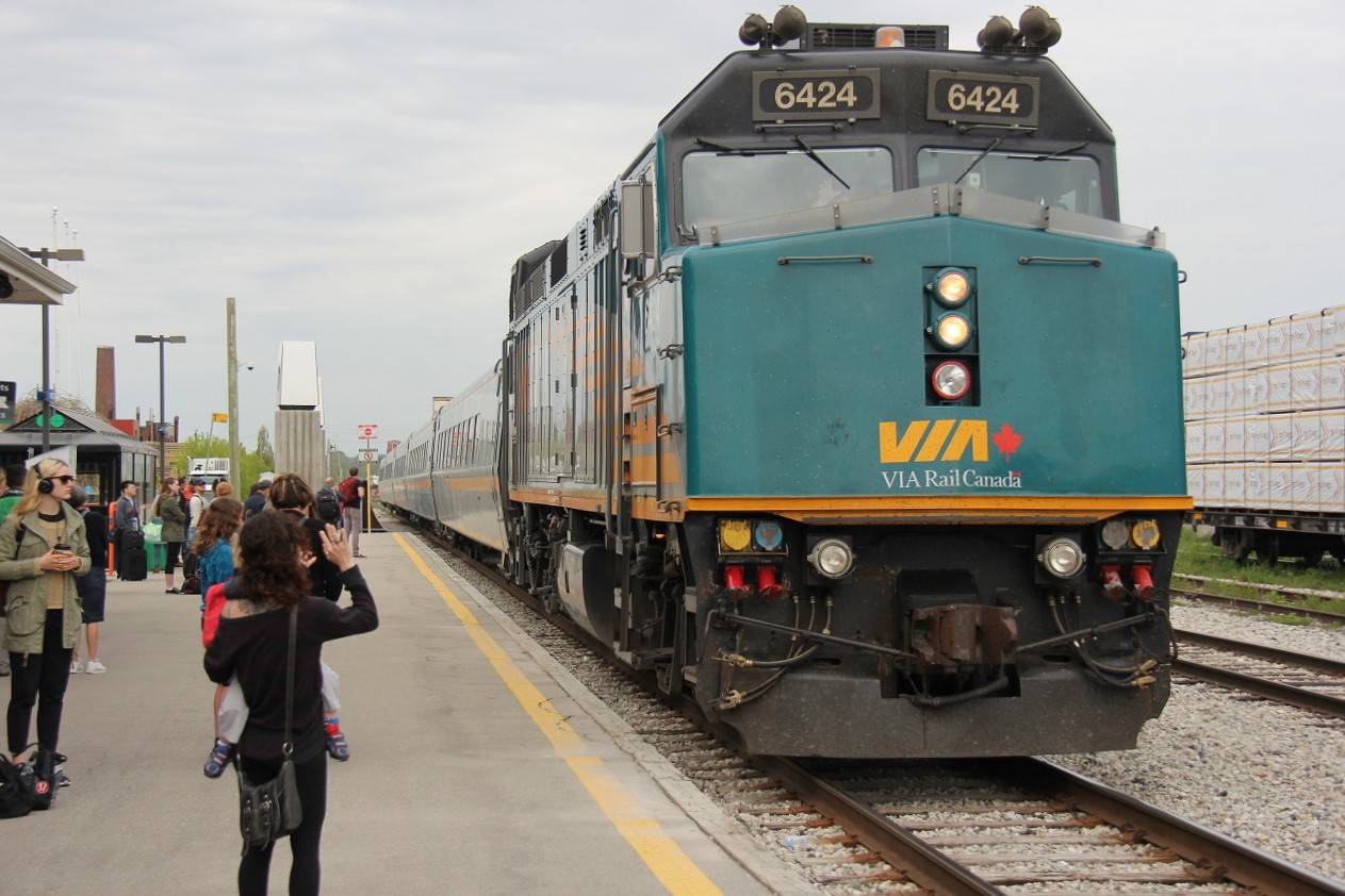 VIA 84 pulls into Kitchener VIA/GO station as passengers wait and greet the incoming train bound for Toronto.