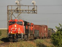 CN 3068 (looking pretty new) and CN 2911 lead CN 398 out of Milton on a hot summer evening at around 19:20.