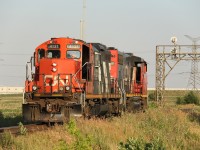 CN 551's crew has their doors open to try and catch a breeze on this hot summer evening. These CN GP9s are still soldiering on well into the 21st Century!