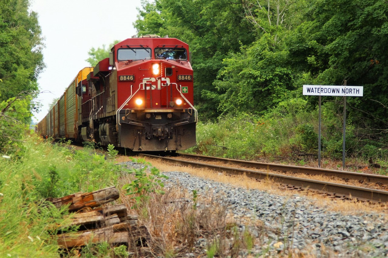Having just climbed their way up and out of the Hamilton basin, CP 247 approaches Concession 6 and MM 67.83, led by CP 8846 with CP 9812 exit Waterdown with 7900 feet of train in tow.