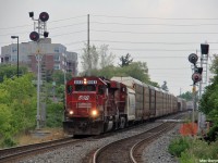 Canadian Pacific 242 has a legendary SOO Line SD60 leading still proud of its SOO paint as they fly into the small town of Streetsville, Ontario on their way to Toronto from the States.
