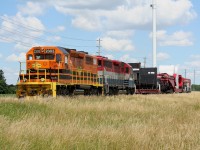 GEXR 516 shoves slowly eastward alongside Highway 7 just east of Guelph proving a fine display of its unusual load to long-weekend travelers on the adjacent main road.

I always wanted to try and shoot something on this open stretch but never got around to it when I lived in Guelph. As luck would have it, I was already visiting the area for the long weekend when I got tipped off about this move.