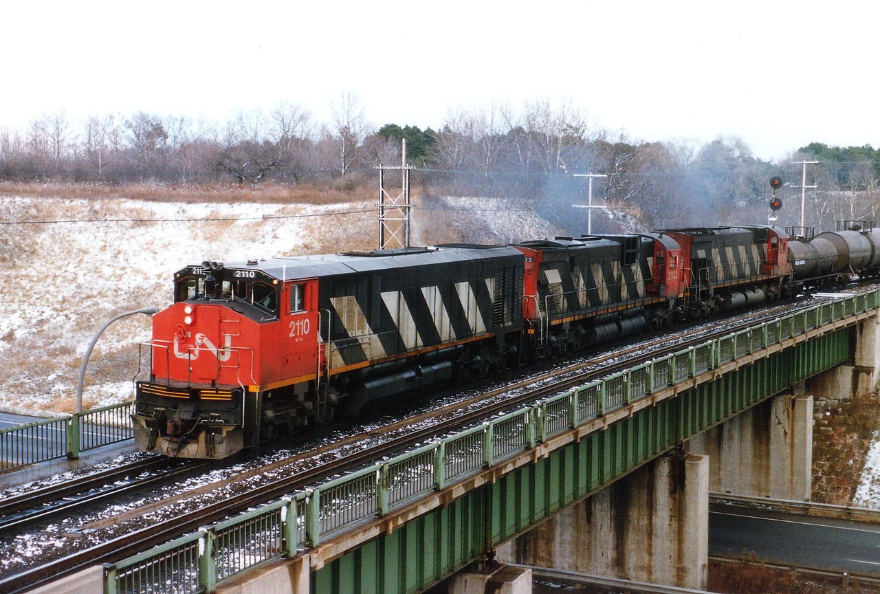 Decent looking westbound CN train captured crossing over the Highway 403 near Bayview. Power is CN 2110, 2033 and 2328; needless to say all long gone from the roster. Note the traffic visible down below. Nada.Zip. Probably just a break in the action but often I wonder where all todays' highway traffic is coming from. Geographically, I have always considered the CN wye here sort of in a no man's land, whether part of Hamilton, Burlington, or Flamborough is up to discussion, but I feel most comfortable identifying the area by the points of the wye....Bayview Jct., Hamilton West, or Hamilton Jct. as the points used to be known. The new ID "Snake" just doesn't cut it. (no offense to the 'Snake' who resides on this group)