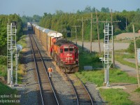 The old and the new co-exist at Puslinch for a very brief couple months. What's happening on the Galt sub? PNR has quickly installed new signal masts at most ABS locations between Guelph Junction and Killean/Galt. The old Searchlight ABS signals, installed in 1944 or 1945 as a result of the very heavy wartime traffic are being replaced, not with CTC - but with new ABS signals. That's right, this isn't a CTC project. Considering the age of the equipment on the Galt sub, it's no surprise. I'm informed a similar 'island' of ABS upgrades are ongoing on the Windsor sub - the entire Galt and Windsor subs will have new signals likely within the next two years if all goes at the same speed and if PNR crews do not continue throughout the fall and winter months. Get your shots - while south of the border, PTC is quickly eliminating classic signal systems, it's also happening here for different reasons.. and your once classic photos will soon be gone.<br><br>In this photo, CP 235 is at track speed iand the tail end is rounding the curve at Puslinch on the main.  With both 241 and 235 running late, the RTC threw 244 into the hole at Puslinch (despite their ability to easily clear the junction - the crew was not happy!) and the conductor is seen heading to reverse the east siding switch and get the hell out of puslinch and into the CTC at the junction.  This was a very nice suprise for this photographer, as it was 0630 when this started going down... and I was in the 'hood' so I stayed put till the action subsided! It was a <a href=http://www.railpictures.ca/?attachment_id=24920 target=_blank>very (1) </a>  <a href=http://www.railpictures.ca/?attachment_id=24876 target=_blank> good (2) </a> morning for me - hopefully you guys in the trades have good mornings too :)