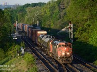 Another case of the early bird gets the worm. At what time does the light hit the rails at Bayview Junction? Keep reading - and plan to arrive just before this time so you can set up in case something is close. And on this day, only <a jref=http://railpictures.ca/author/corncitymofo target=_blank> Bill Miller </a> and I were there to witness whatever was coming - hoping to see the business train cars on 422 later in the morning - little did we know what was in store for us early birds...<br><br>Upon arrival at the crack of dawn we were met with  an eastbound lined through Bayview from Hamilton, being this early we did not know what to expect. 422 was never this early.  As the train approached all you could hear was the familiar growling of an EMD 16 cylinder 567 as the train pulled a hundred plus cars through the grade out of Hamilton Yard, the EMD engine clearly making much more noise than the leading GE. Then the business cars were seen behind the power - surprise ! - out of the shadow into the beautiful early morning light - Click! The time is 0628 and light has been on the rails for 10 minutes.  This was Extra 422, A422 would roll by at the usual 10 or so in the morning. The boys arriving on-time for A422 were quite disapointed to know they had missed the business cars :)