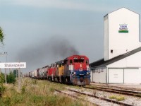Eastbound morning GEXR train #432, with GEXR 4096, LLPX 2236 and RLK 3835 rolls past the feed mill complex at the S/W corner of the village of Shakespeare. This was a favourite location for me in years past.