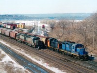 Side by side: RLK 4205 and 1201 at work in the former CN (now SOR) Stuart St yard alongside Niagara-bound CN train GCFX 6068 and WC 6934. Confusion abound (for me, anyway)at this time as old CN SD40s were being upgraded to SD40-3 and the transition from CN to Alsthom to Wisconsin Central ID was erratic.  These two units were former CN 5112 and 5146. Renumbered and upgraded when GEC Alsthom gray (owned by Connell Finance) to GCFX 6064 and 6068. THEN they were relettered to Wisconsin Central as 6934 and 6938.......but, at the time of this photo the 6068 has not yet been relettered/renumbered. The RLK? Well, 4205 was scrapped in 2008 and the 1201 has gone to an industrial park in Sarnia, ON.