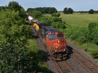CN A438 passes MP 6.7 at Frank's Lane bridge with a special unit trailing. ex ETR 102, now OS 102 trails behind a CN dash 9 and gets dropped off at London East. Will it get transferred to OSR by CP or CN from London? 
