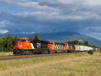 Brand new CN ET44AC 3064 teams up with C40-8Ms 2405 and 2415 passing Mile 229 of the Edson Sub with M302's train.