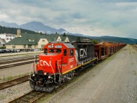 WC GP40-2 3027 sits quietly in track 5 at Jasper with a loaded rail train to be dumped on the Albreda Sub between Canoe River and Jasper. The beautiful Jasper train station sits in the background as does Pyramid Mountain, trying to poke through the clouds... which it has tried to do for much of this miserable summer we've been having!