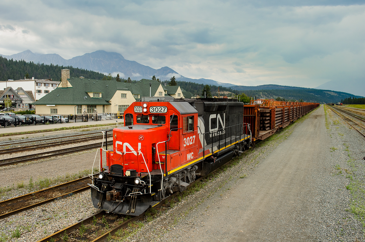 WC GP40-2 3027 sits quietly in track 5 at Jasper with a loaded rail train to be dumped on the Albreda Sub between Canoe River and Jasper. The beautiful Jasper train station sits in the background as does Pyramid Mountain, trying to poke through the clouds... which it has tried to do for much of this miserable summer we've been having!