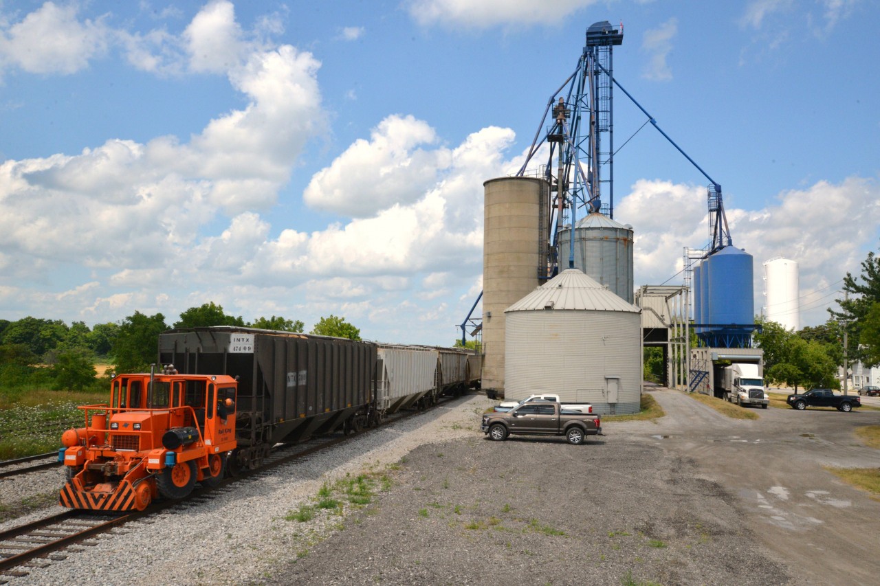 Introducing newest rail entity (2015)to utilize rail service from Southern Ontario Railway on the Hagersville Sub. Railview Investments operated by L.F. Mattice Farms & Trucking Inc. of Hagersville (Dedicated Carriers of Edible Grain)is a full service storage & trans load facility conveniently located on #33 siding (new) adjacent to SOR's main line through Hagersville. Siding #33 with a length of 1450', switch and derail was installed June 2015 and utilized initially to provide convenient inbound trans loading services (e.g. millet) to Armstrong Milling Co Ltd, Nelles Corners, ON. Incidentally, siding #33 replaces an old time, idle Grand Trunk Stock Yard siding of years past. This photo depicts the Mattice clan and Railview facility transloading wheat from truck to rail car as part of a thirty 90 ton car order. Special thanks to both Fred and Freddie Mattice for permission to photograph and be part of the track installation and first few inbound and outbound shipments. SOR tends to spot cars in conjunction with its northbound, nocturnal RLNN 597. Consequently photos in good lighting are difficult to obtain but alas I have a few, including SOR motive power and railroading events, in reasonable lighting to submit in days following. A hometown proud, success story and rewarding, interesting experience!