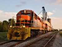 This is the 2nd photo of a proposed short series featuring Southern Ontario Railway (SOR) and the outbound kick-off of Railview's Trans Loading Services at Hagersville.  RLHH 597 with RLHH 3404 (lead) and RLHH 3409 are seen idling on siding #33 and soon to depart with the first outbound shipment of grain cars loaded with this years local grown wheat.  AEX 14952 grabs the honour of being the first grain car of the Railview consignment, arriving from southern USA via Fort Erie, to be loaded here with 90 ton of Haldimand County grown wheat.  CN Hagersville's signage is in the background and a few of the Mattice family can be seen in the foreground also capturing the moment.  This enterprise should attract a measure of local interest for years to come.  In fact and as I am adding text, I hear this night's nocturnal RLHH 597 rumbling through town and along side Railview elevators just a block away ... music to a railfan's ears.   