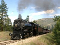 Kettle Valley Railway's excursion train powered by the spit & polished steam locomotive 3716 is seen returning up grade to the Prairie Valley Station at Summerland, BC after its two hour junket through Prairie Valley, its scenic vistas and open view of Okanagan Lake from high a-top Trout Creek trestle (238 feet above the canyon floor).
