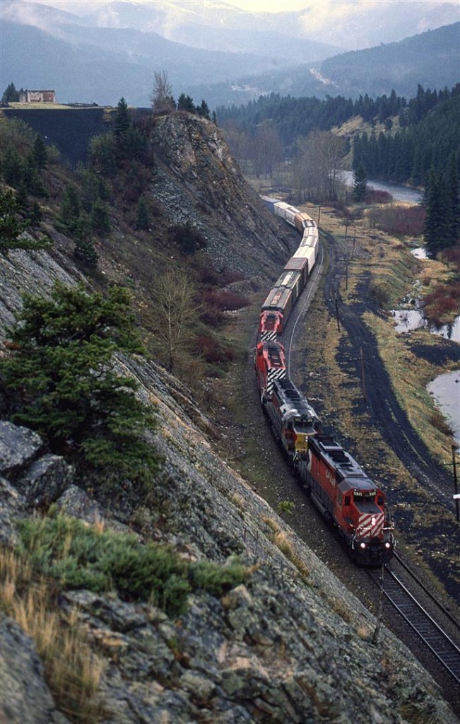 Now is old coal country, this westbound manifest is approaching Bellevue, in eastern Crowsnest Pass. In about a minute or so, the train will pass through the devastation of Frank Slide. Although there is plenty of coal in this area, mining had ended by the time this photo was taken (and likely many years before then.)