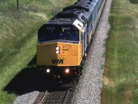 Although VIA had started receiving F40PH's in late 1986, they didn't really start showing up on the "Super Continental" until mid '88. This is likely due to them being used on the east coast trains where they replaced old MLW FPA-4's. Note that the second unit is an older covered wagon B unit. I don't think that the passenger cars were converted from steam at this time.