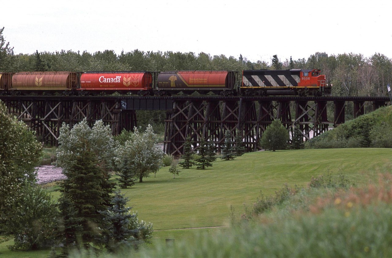 Now that I had a radio scanner, railfanning in Edmonton became much more interesting. What was cool, was the fact that the RTC's would broadcast the daily lineups each morning at 0800. I can't remember whether I heard the Sangudo Sub RTC or if I just heard the engine coming off the shop speaking with the "Switchtender". Either way, I knew that this train was headed up the Sangudo Sub, so I road my bike up to St Albert to bag this shot. It is crossing the Sturgeon River, and will service the on-line businesses all the way to Whitecourt.