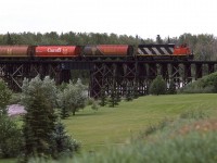Now that I had a radio scanner, railfanning in Edmonton became much more interesting. What was cool, was the fact that the RTC's would broadcast the daily lineups each morning at 0800. I can't remember whether I heard the Sangudo Sub RTC or if I just heard the engine coming off the shop speaking with the "Switchtender". Either way, I knew that this train was headed up the Sangudo Sub, so I road my bike up to St Albert to bag this shot. It is crossing the Sturgeon River, and will service the on-line businesses all the way to Whitecourt.