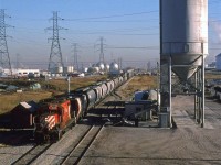 I did not shoot too many CP trains while living in Calgary. Pity.
The SW bound transfer has several hoppers and a few auto racks. I don't know about the hoppers, but I suspect that the auto racks were picked up at CN's Clover Bar yard where a auto transfer facility is located.
