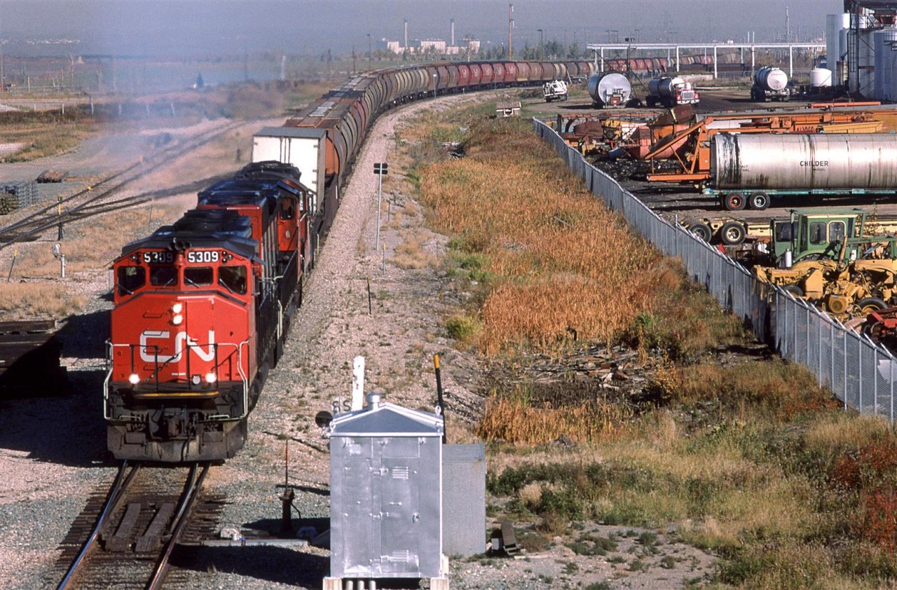 Good 'ol #484. This train was very reliable. It would leave each morning between 0800 and 1000. It was easy to pick out too because it was pretty much the only train around that had a few TOFC and/or TOFC on the head end. The destination was Calgary, but it would do work along the way. I don't know if this was a regular occurrence, but I once saw it at Red Deer on the Brazeau Sub. Another train, #550, would usually deal with Red Deer and the Brazeau Sub. Perhaps someone with more knowledge could correct me? 
At some point in the near future, #484 would be re-numbered to #444.