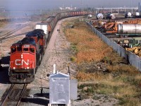 Good 'ol #484. This train was very reliable. It would leave each morning between 0800 and 1000. It was easy to pick out too because it was pretty much the only train around that had a few TOFC and/or TOFC on the head end. The destination was Calgary, but it would do work along the way. I don't know if this was a regular occurrence, but I once saw it at Red Deer on the Brazeau Sub. Another train, #550, would usually deal with Red Deer and the Brazeau Sub. Perhaps someone with more knowledge could correct me? 
At some point in the near future, #484 would be re-numbered to #444. 