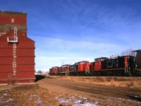 Another town, another grain elevator, another siding and another dropping of cars to be filled. This is all abandoned now, and the elevators have be razed.