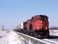 214 stops at Bruce to meet the eastbound "Super Continental". The engineer decided that it would be a good time to check something on the lead locomotive.
This meet could not happen to today, a this siding has been removed (as have several others on the Wainwright Sub.