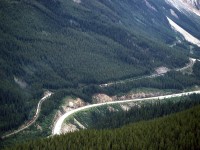On a climb up Paget Peak, we were able to view the Kicking Horse Pass well below us. This is an eastbound at Partridge. The east switch of Yoho, on a section of track where the trains have to go west uphill, may be seen at right. In addition to this view, one could look down the entire pass to Field, and also view Wapta Lake.
I suspect that other people have similar photos, but they are not likely to be railfans.