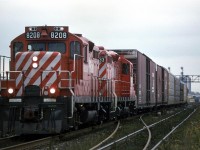 This is a CP train operating on CN/'s Oakville Sub. Someone once told me what train this was, but I did not put it in my notes. I think it was a trackage rights situation, so that CP could access the Ford plant just to the west of this spot. I can't be certain, but I think that I am at Winston Churchill Blvd. The signal bridge fits but the apartment just does not seem correct.