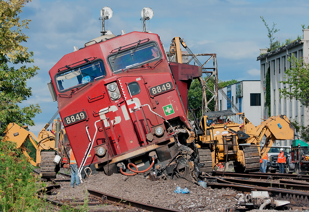The aftermath of this mornings sideswipe at Howland between light power CP 235 and the tail end of CP 118 (now gone), Hulcher crews are on scene ready to lift the power back on the rails. Luckily no injuries.