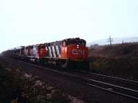 In the days before welded rail and ditch lights, M-420 2556 leads a pair of SD-40's east approaching Port Hope. The M-420's would later be lightened and renumbered to the 3500 series. Photo by my brother.