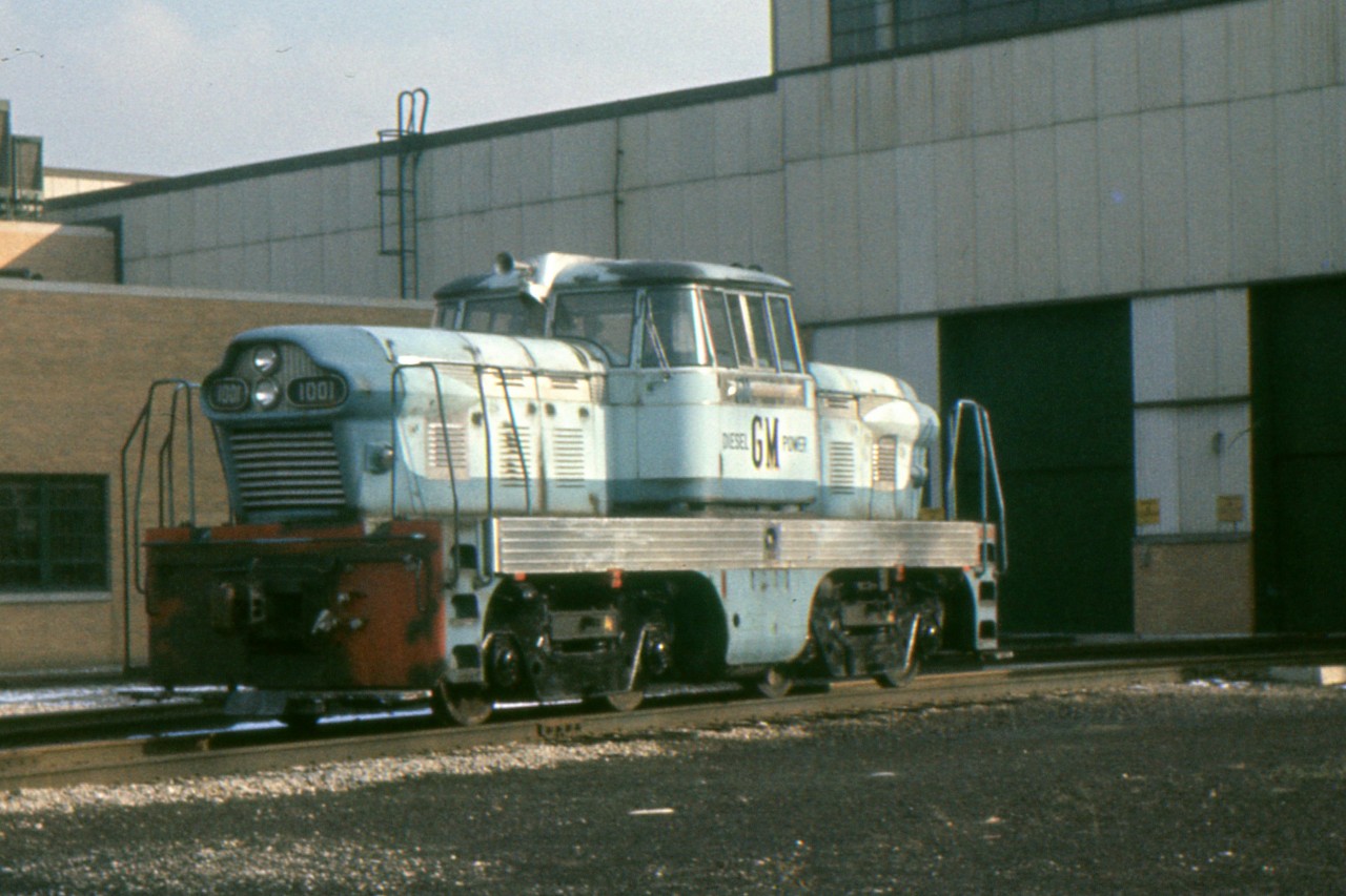 In the mid 1950s General Motors Diesel in London, designed and produced a handful of diesel-hydraulic locomotives. They were hardly a success. Of the GMDH1s one was exported to Brazil and one to Pakistan and one dubbed the "Blue Goose" remained in London as plant switcher. A GMDH3 model went to subsidiary McKinnon Industries in St. Catharines as their plant switcher. In this photo by Clayton Morgan, we see the Blue Goose at GMD London on November 21, 1959.