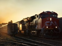 CN ET44AC's 3086 and 3088, factory fresh from Fort Worth, TX lead M398 through Brantford a few minutes before sundown