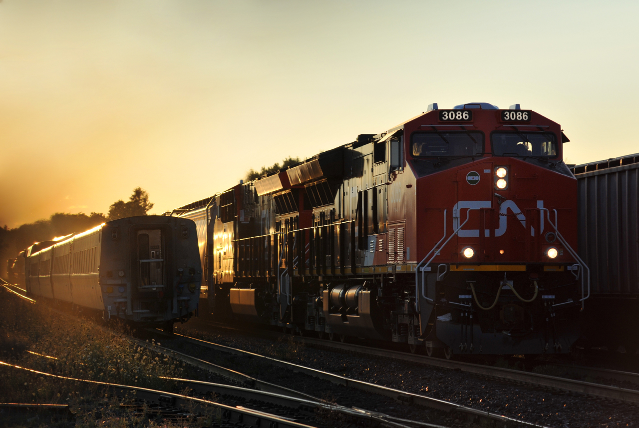 CN ET44AC's 3086 and 3088, factory fresh from Fort Worth, TX lead M398 through Brantford a few minutes before sundown