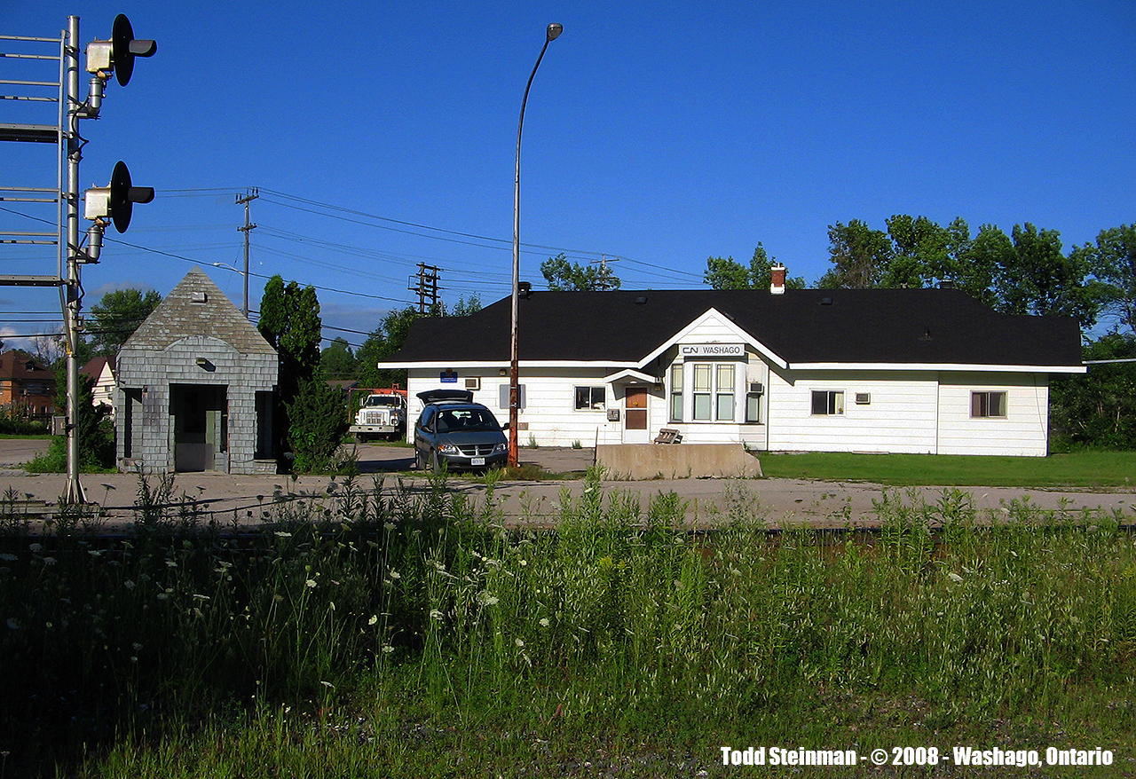 The station at Washago - another one of those small community stations that has stood the test and change of times. To note...from four tracks down to one, the station is still used by crews only. VIA built a shelter of it's own sometime in the 90's, maybe earlier. And of course, the CTC signals. I'm sure these have been replaced by the more popular modern style. The old 'bridge' that housed the signals for all four tracks was still standing from my visit in 2008 (although quite rusty). And of the former roadbeds, some of it was filled in for an even walking surface for those boarding or disembarking the train at Washago...and the rest was taken over by weeds (as seen in the foreground, shadowing the Bala Sub.).