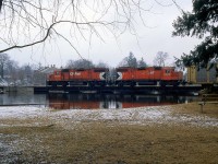 CP's Toyota switching job is returning through Preston, with GP38-2's 3038 and 3105 in charge, shown crossing the Speed River bridge on the old Grand River Railway line.
<br><br>
A view crossing the bridge nearly 50 years before: <a href=http://www.railpictures.ca/?attachment_id=22965><b>http://www.railpictures.ca/?attachment_id=22965</b></a>