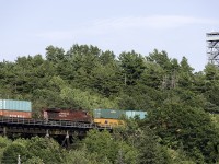 The iconic fire tower, source of so many great CP shots watches over another CP stack train crossing the Seguin River