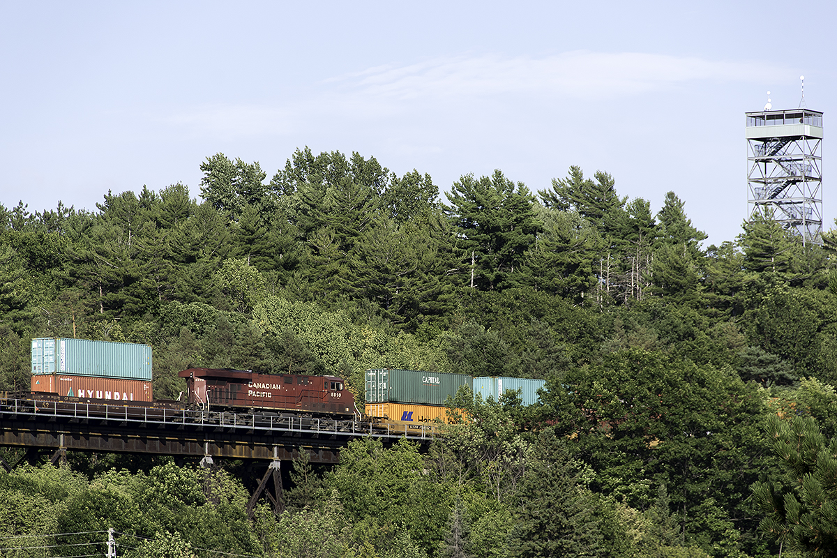 The iconic fire tower, source of so many great CP shots watches over another CP stack train crossing the Seguin River