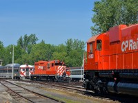 <b>CP Rail staredown.</b> GP9 CP 1608 and M630 CP 4563 are facing each other at Exporail on a sunny morning. Behind CP 1608 is RDC-1 CP 9069.