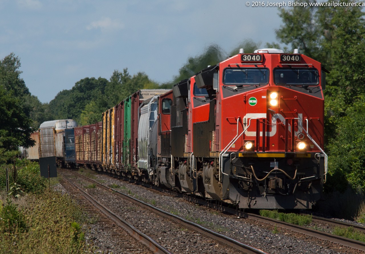 CN 394 rockets into Lynden behind a pair of Tier 4 GEVO's and a SD75i on a muggy Saturday morning.  The now almost year old GE still looked pretty good to me!