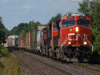 CN 394 rockets into Lynden behind a pair of Tier 4 GEVO's and a SD75i on a muggy Saturday morning.  The now almost year old GE still looked pretty good to me!