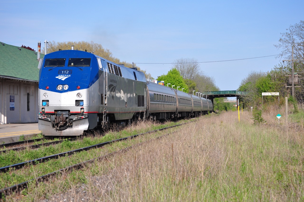 I always here the same comment about the Grimsby Subdivision, whether it's when I'm railfanning along the line or posting photos online: "man, for a mainline it's awfully grassy." For a mainline, it's pretty overgrown. The line sees about 4 or 5 trains on a weekday and more on summer/holiday weekends when the GO train runs the line. The Grimsby is going to major changes though, as the line is being prepared for fulltime GO service. If they do cut down the weeds, it'll be open for some shots that haven't been clear for shots in a while, so I'm quite ready for that :)
