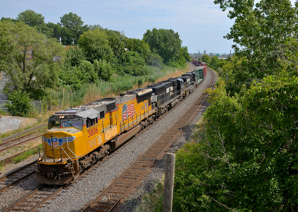 Flying the flag, in Canada. Adding some colour, as well as American patriotism to the usual all-NS lashups on CN 528/529, SD70M UP 3806 with the UP wings on the nose and the American flag on the hood leads CN 529 through Montreal West with a short train. Trailing are NS 6983 & NS 9535.