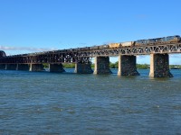 <b>Consecutively numbered Bluebirds over the river.</b> CEFX 1057 & CEFX 1056 lead empty ethanol train CP 651 over the St-Lawrence River towards the end of the AMT commuter rush in the morning.
