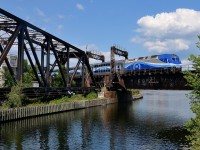 AMT 811 is on the way back from Mont-St-Hilaire as it crosses the Lachine Canal near Montreal's Central Station.