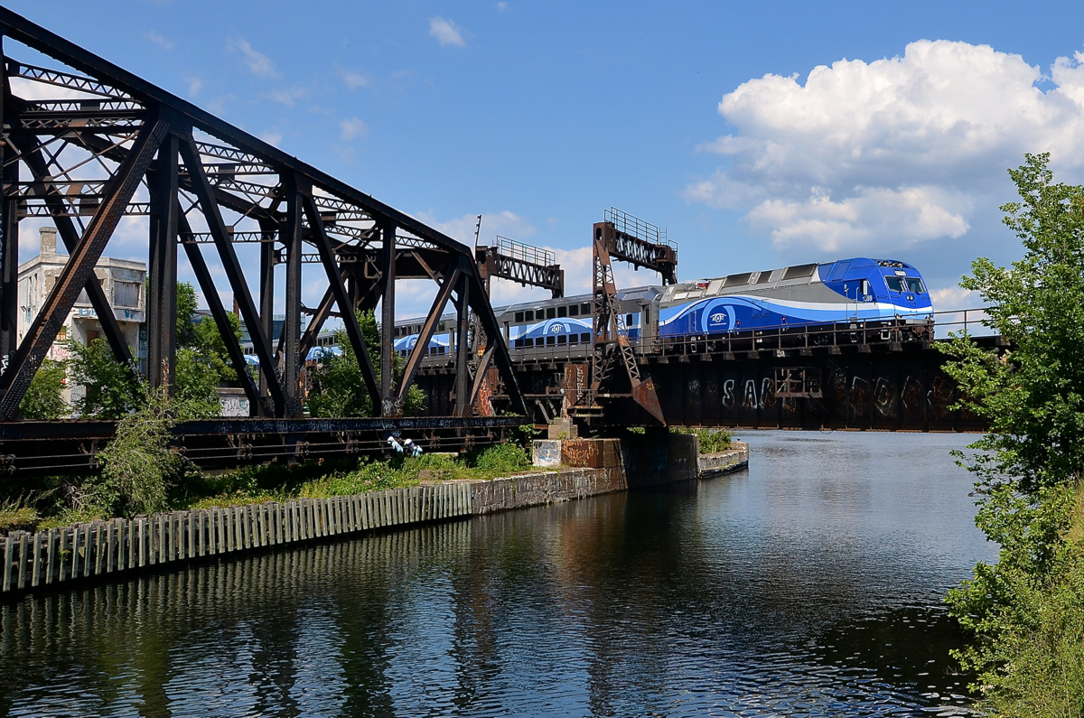 AMT 811 is on the way back from Mont-St-Hilaire as it crosses the Lachine Canal near Montreal's Central Station.