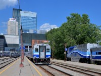 <b>Beginning of the afternoon rush hour.</b> It's the beginning of the afternoon rush our as AMT 1326 at right brings a Candiac-line deadhead train into Lucien L'Allier station. Another Candiac train (AMT 87) is in the middle led by cab car AMT 701 and it will depart in about 15 minutes.