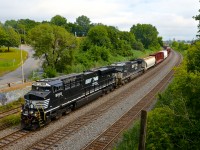 <b>A rare newly built Tier 3 unit.</b> CN 529 with 32 cars is through Montreal West with an interesting leader. NS 8168 is just one of three Tier 3 compliant ES44AC's built for NS a couple of months ago (NS 8166-NS 8168). While NS, like most North American Class I's is primarily receiving Tier 4 ET44AC's, the three new ES44AC's were allowed due to GE applying emission credits that had already been banked towards them. Trailing is a much older GE, ex-Conrail NS 8445 (built in 1994). Both units were built at the Erie plant.