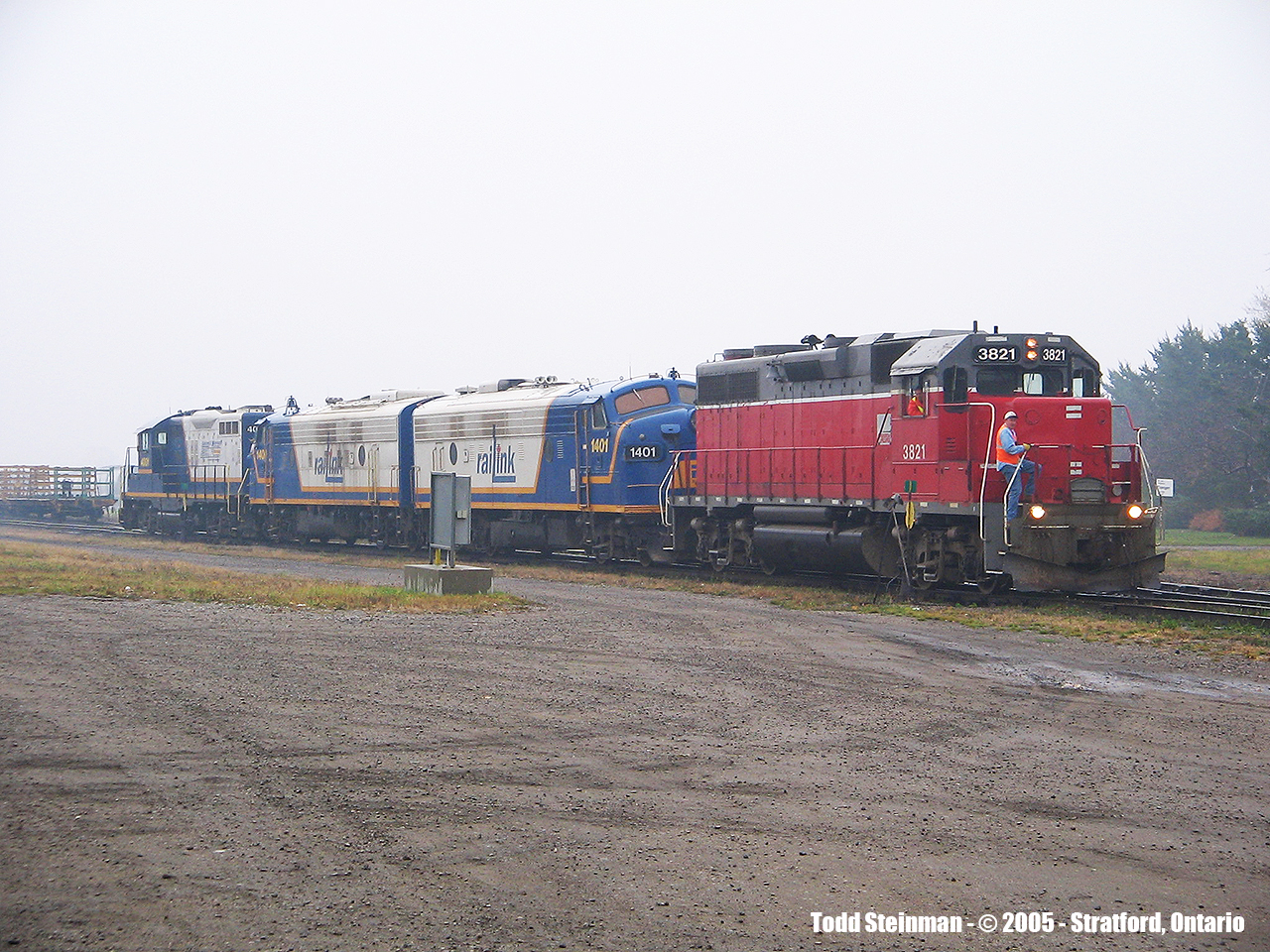 On a very miserable, yet warm but foggy November day, I visited the Stratford station. To my luck, I actually saw two GEXR trains this day. However, being more into railway stations back then, I did not get a lot of decent photos of the trains. However, out of the select few, I am submitting the first of two.....(note the engineer and conductor look on as they get ready to depart Stratford, and in their tow is now OSR 1401 in full RailLink regatta as well as sister 1400, with 4001 in tow.


Anybody have any information on 1400 or 4001?