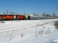 <b>Approaching a pair of SD40-2's.</b> In the winter of 2008 a CP westbound led by two venerable SD40-2's (CP 5576 & CP 5865) cools its heels while an AMT westbound passes with cab car AMT 706 leading and AMT 400 pushing. These AMT Comet II cars would be rebuilt and repainted a few years later. CP 5576 was retired later that year whereas CP 5865 was still on CP's roster as of the start of 2016.